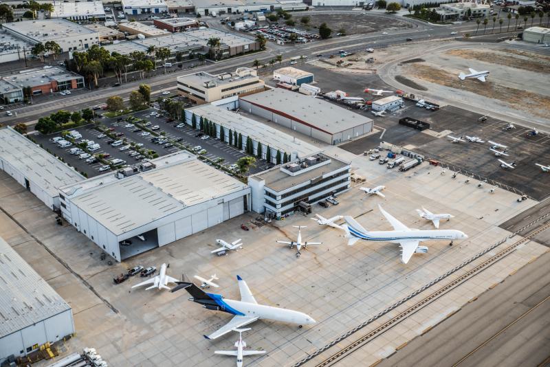 A view from above the airport looking down at the parked jets