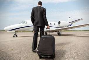 Man with Briefcase Boarding One-way Jet Charter | Stratos Jet Charters, Inc.