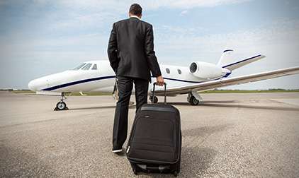 Man with Briefcase Boarding One-way Jet Charter | Stratos Jet Charters, Inc.