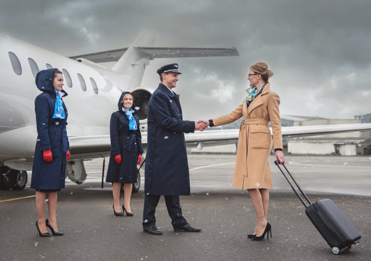 Woman greeted by private jet crew as she gets on a private jet