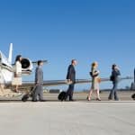 Group of business executives leaving a private jet