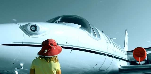 child look at on-demand private jet charter from the tarmac