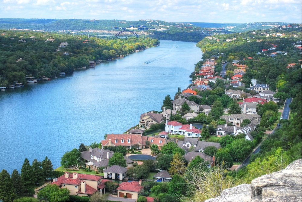 A boat floats on the water in Austin, Texas.