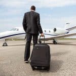 A businessman walking towards a private jet