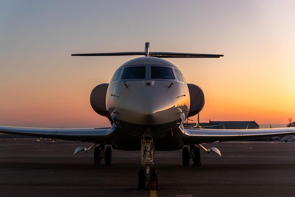 A private jets sits on the runway